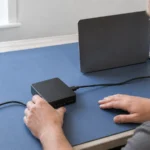 Organized civil case files, a laptop, and a recorded interview setup on a conference table